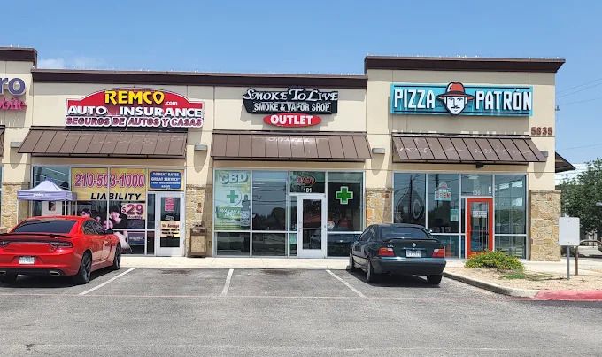 Smoke To Live at 5835 Culebra Rd, between Remco Insurance and Pizza Patron, with front parking