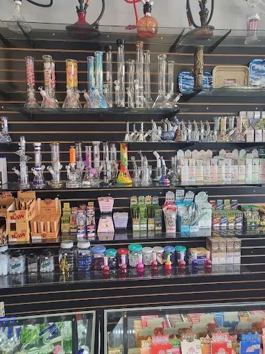 Water pipes, rolling papers and vape products on the wall at Smoke To Live San Antonio